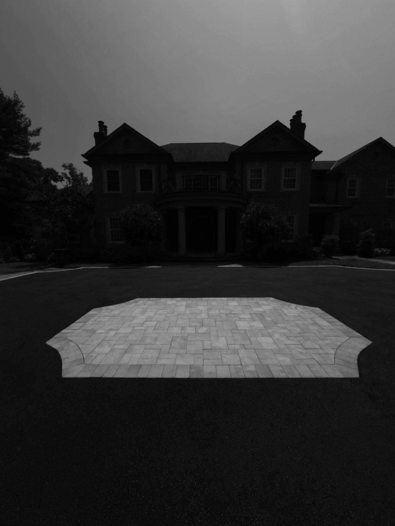 Custom paver medallion centerpiece with estate mansion in background, Lloyd Harbor Gold Coast