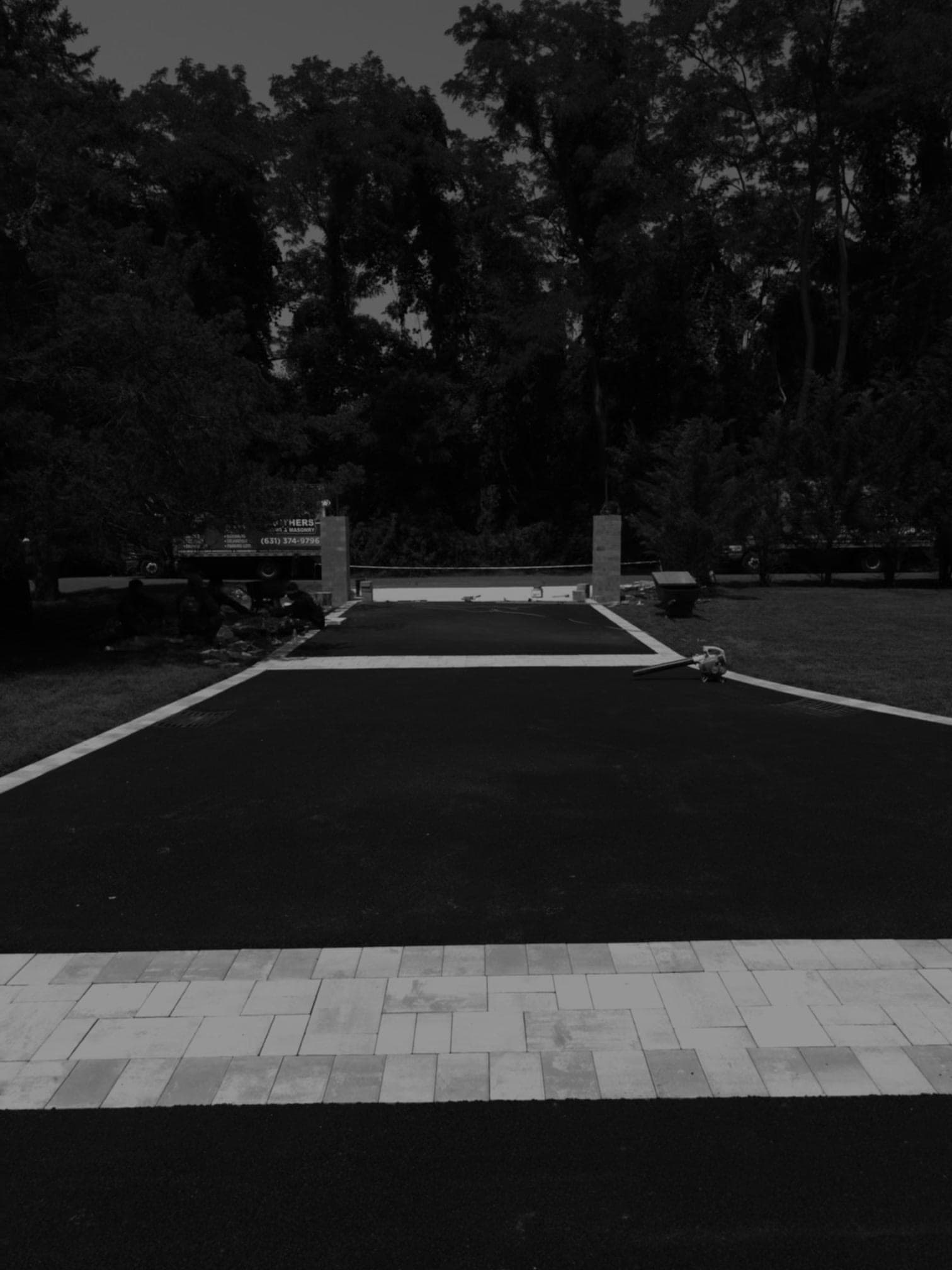 Paver apron at estate driveway entrance with Brothers Paving truck in Lloyd Harbor