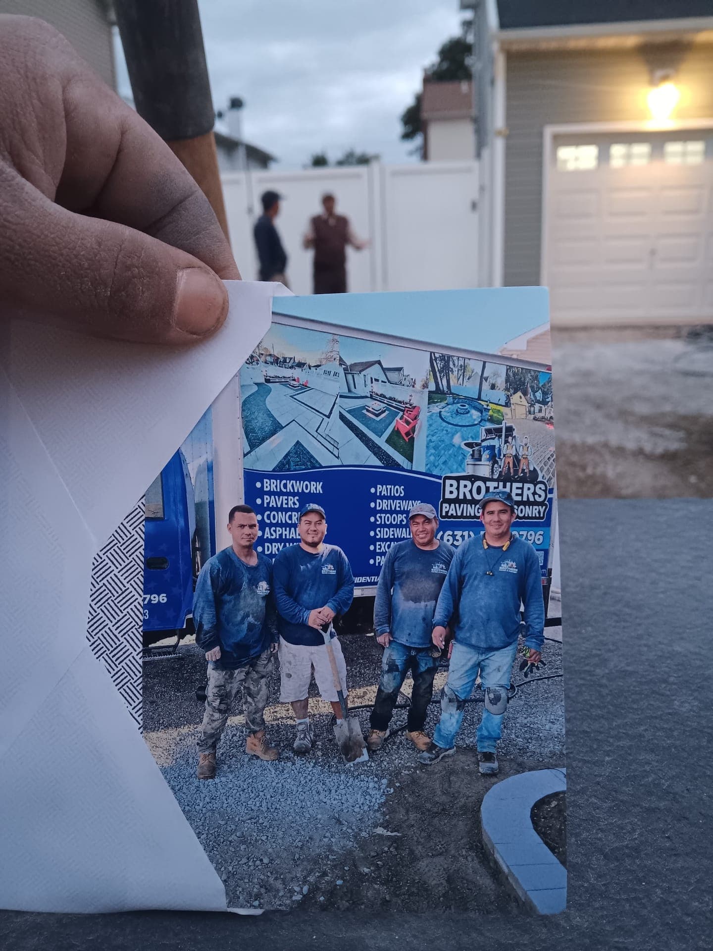 The full Brothers Paving crew standing in front of a branded truck
