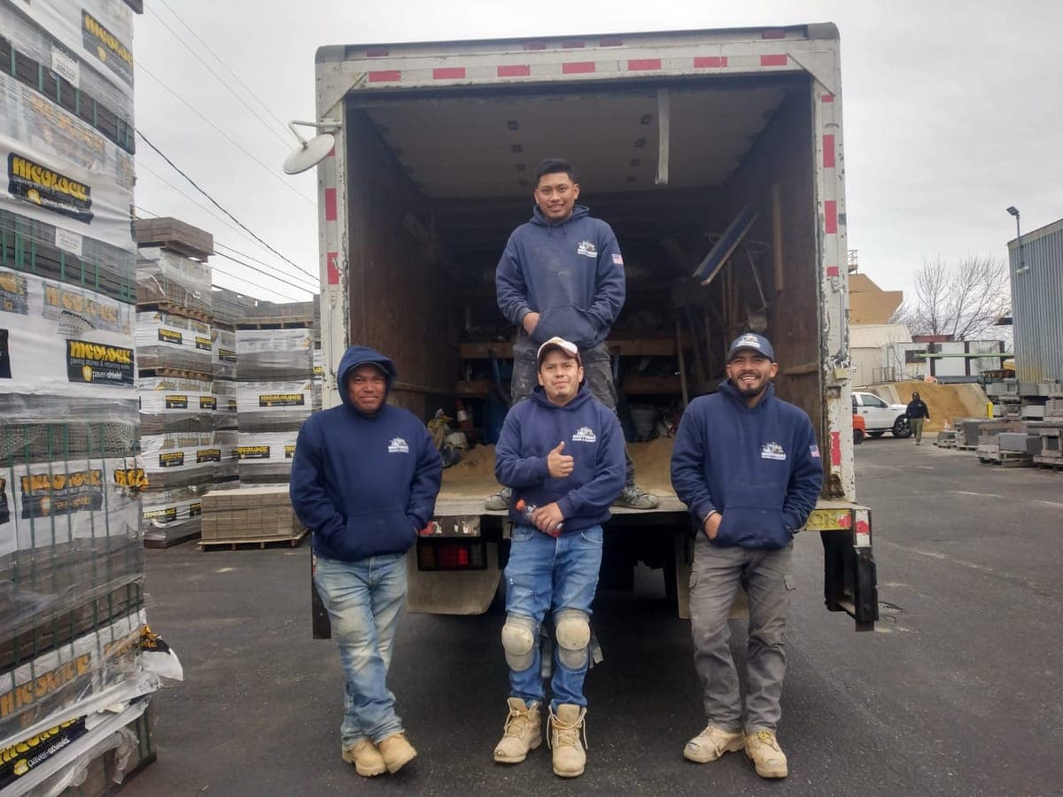 Brothers Paving crew at the supply yard in matching hoodies