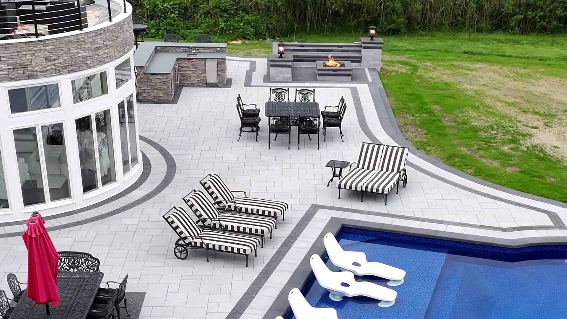 Aerial of the finished pool, raised spa and outdoor kitchen in Great River, Long Island
