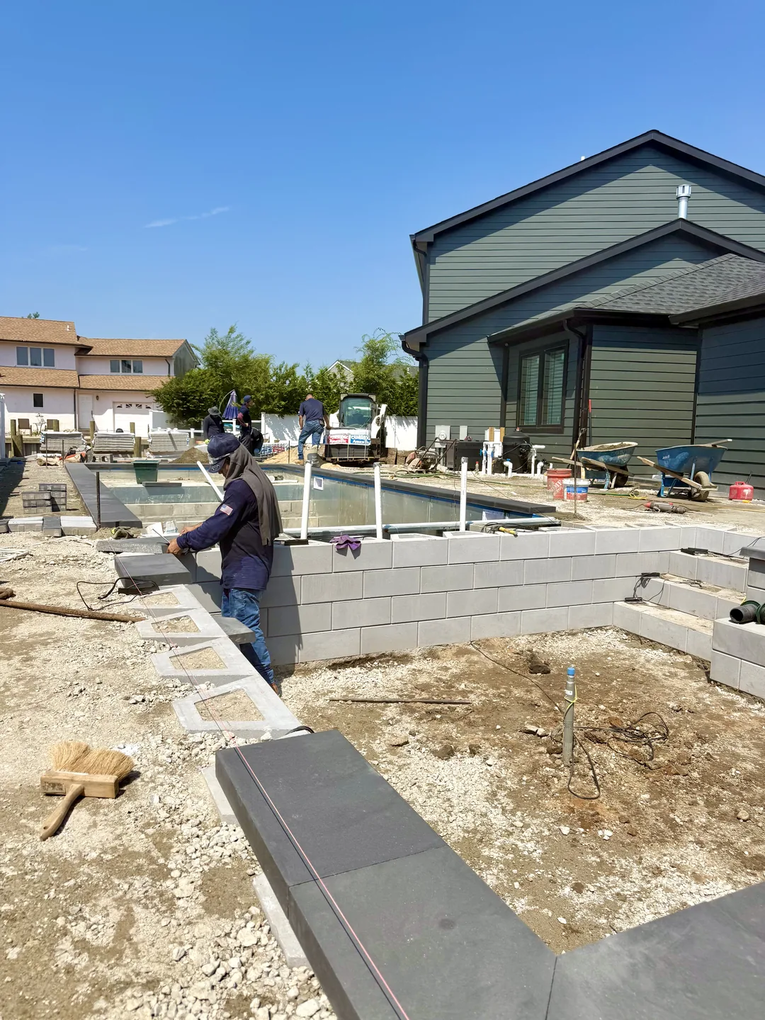 Brothers Paving & Masonry crew building the structural block walls on the Massapequa site