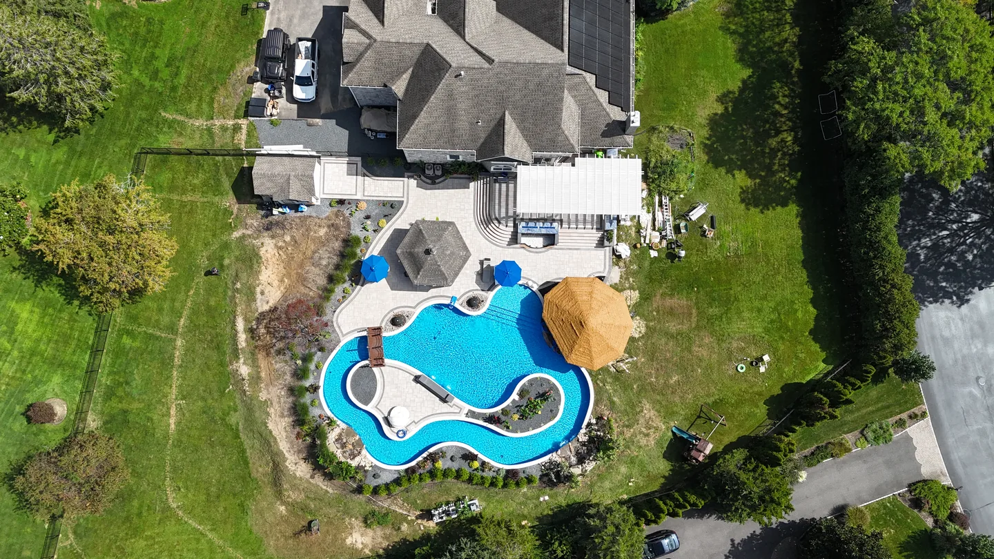 Overhead of the finished lazy river, deck and house from the approach side, East Northport