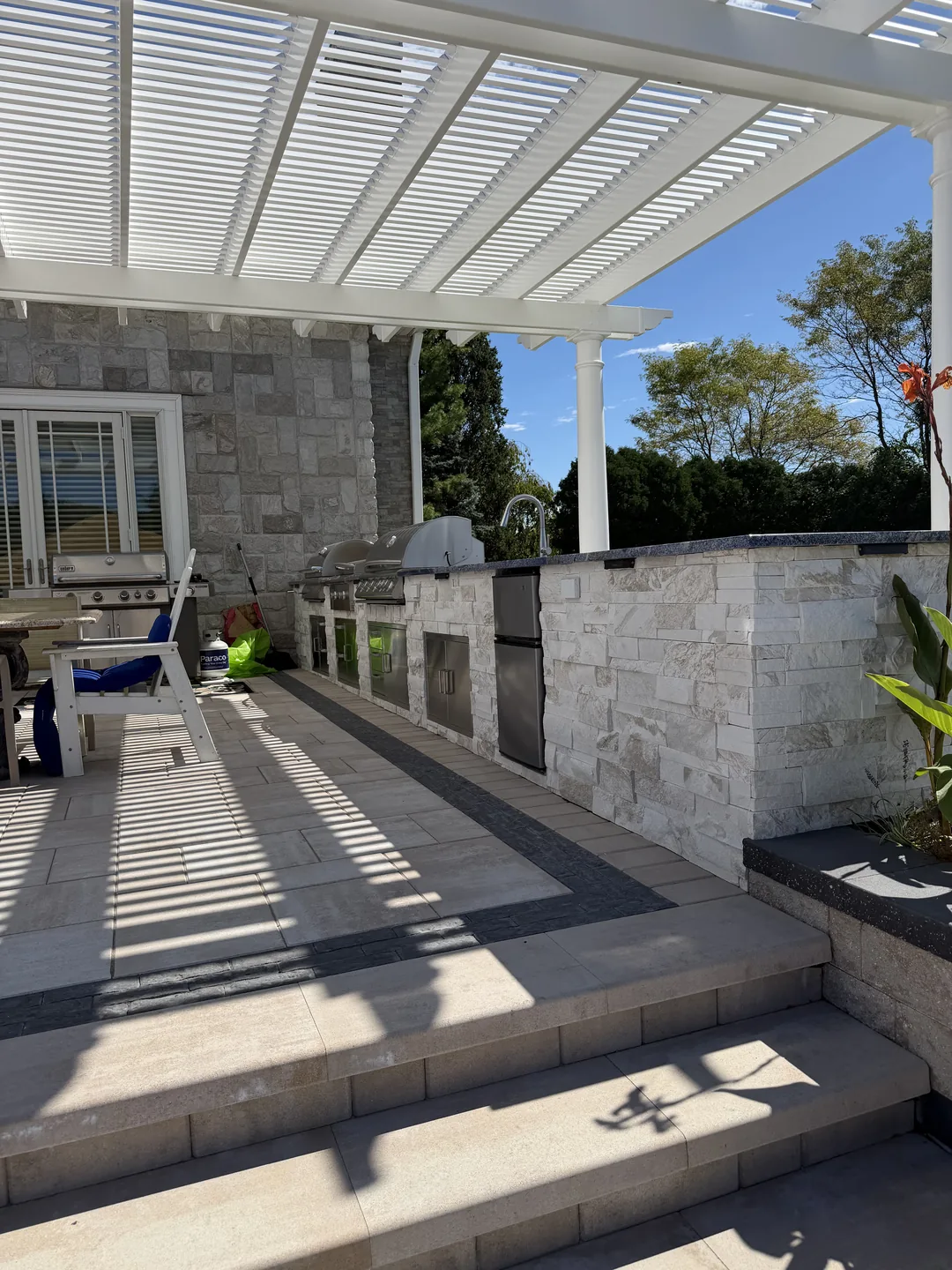 Pergola over the dining area beside the house, East Northport