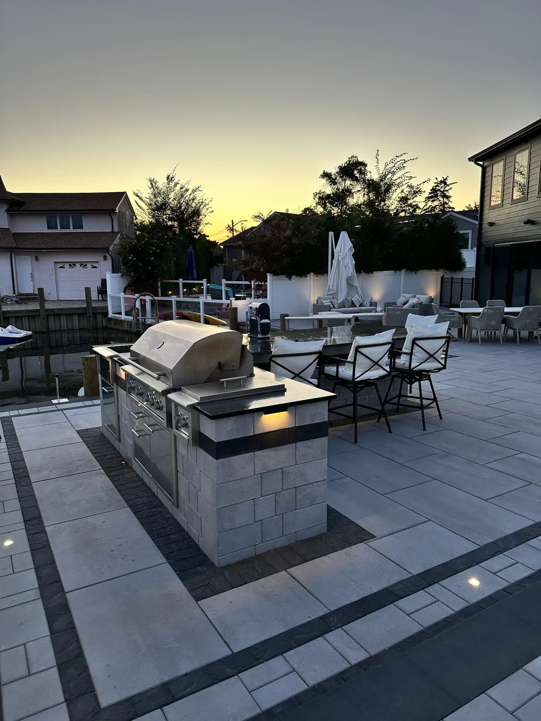 Outdoor kitchen with built-in grill at dusk, Massapequa