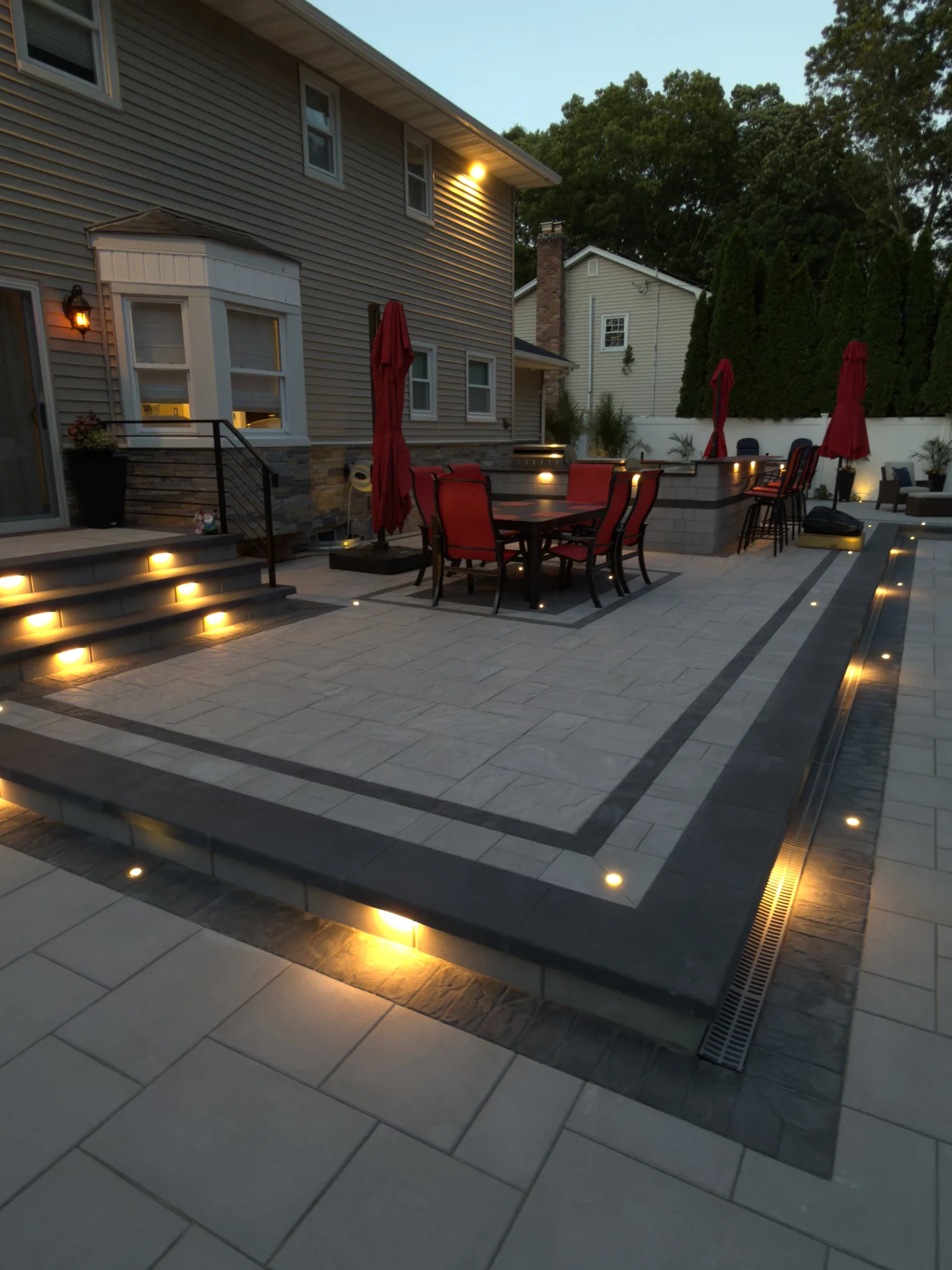 Dining terrace stepped into the deck with lighting set into the risers, Nesconset