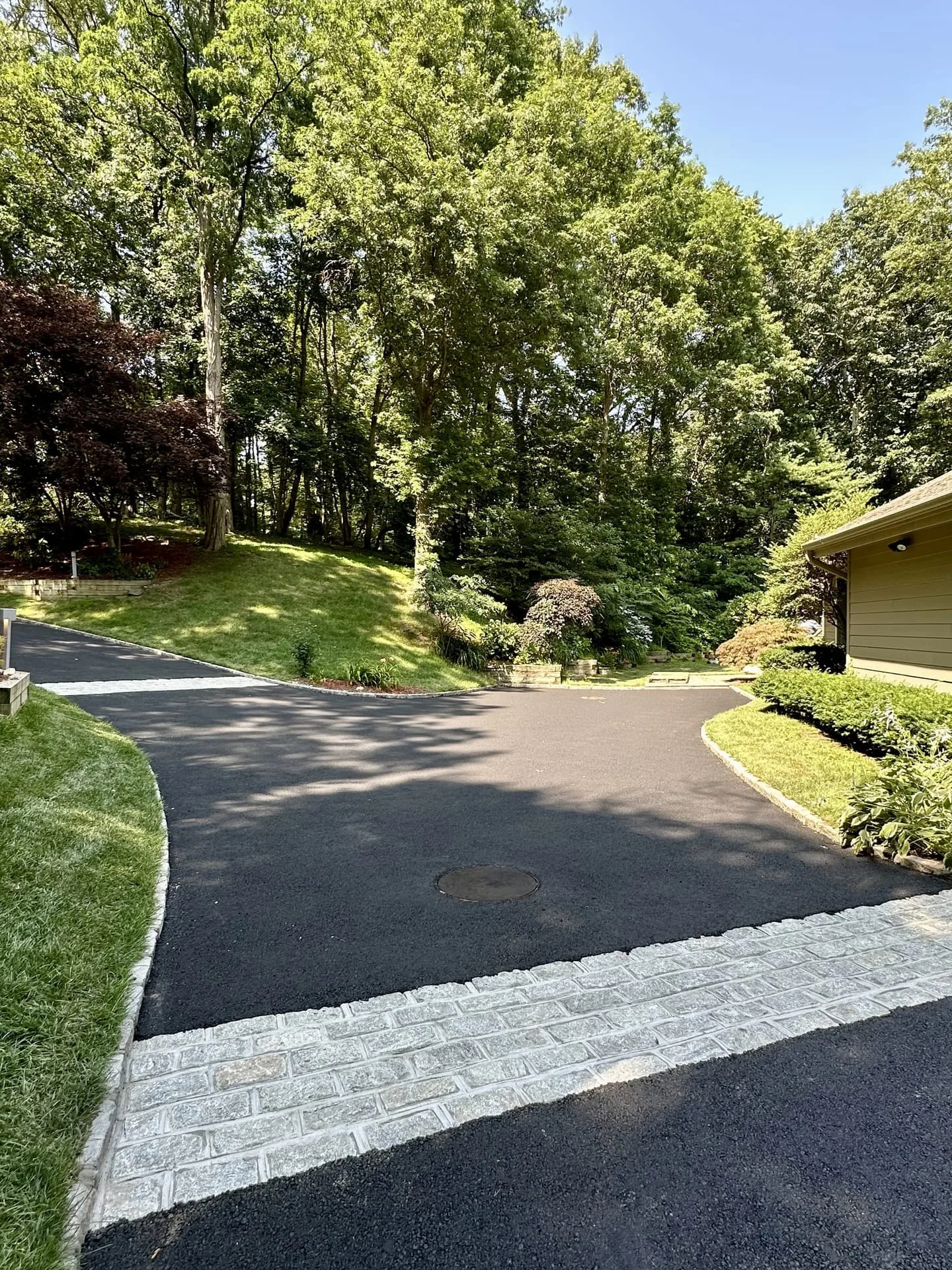 Belgian block estate driveway through wooded Gold Coast property