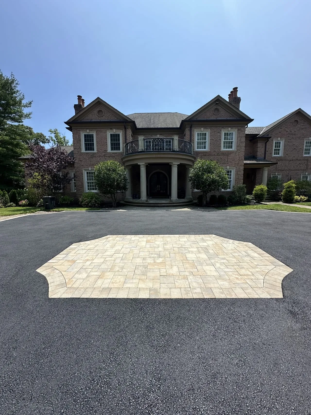 Custom paver medallion centerpiece with estate mansion in background, Lloyd Harbor Gold Coast