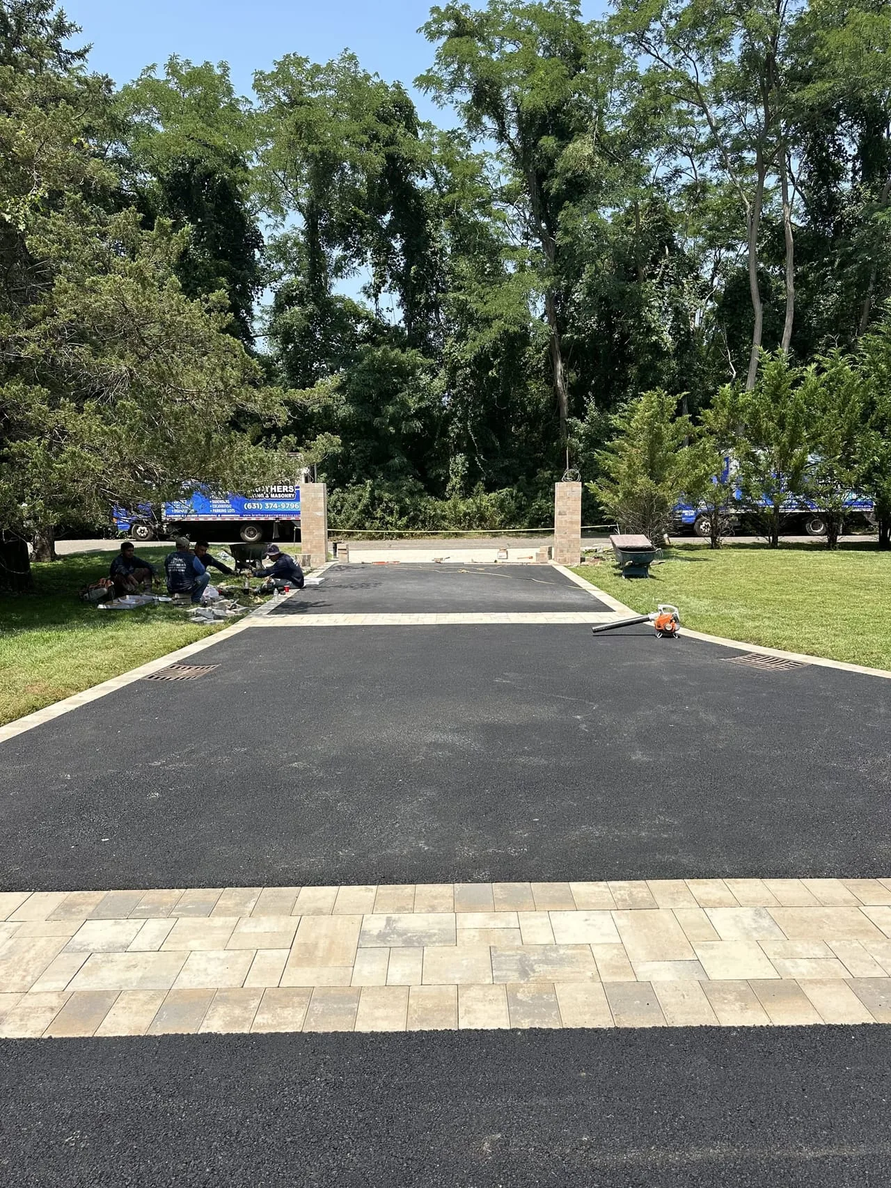 Paver apron at estate driveway entrance with Brothers Paving truck in Lloyd Harbor