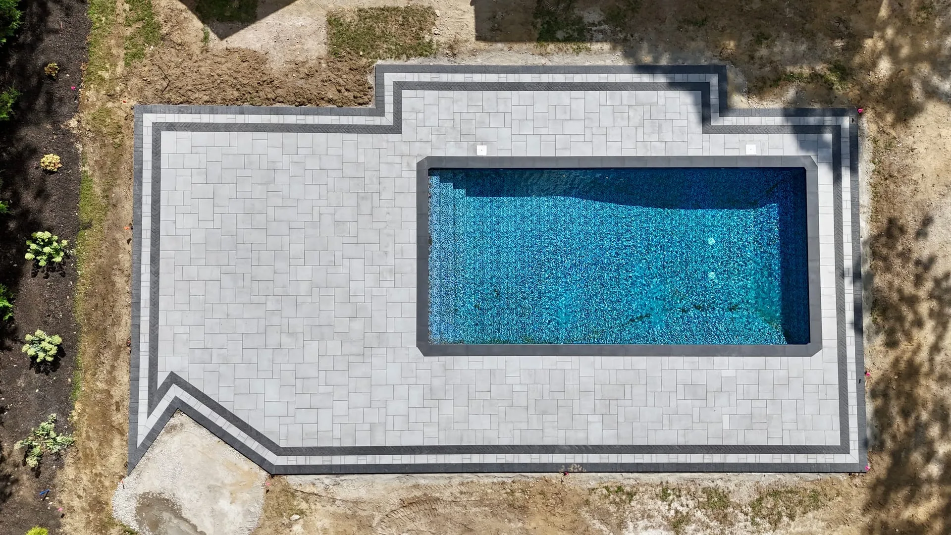 Pool hardscape project in Commack