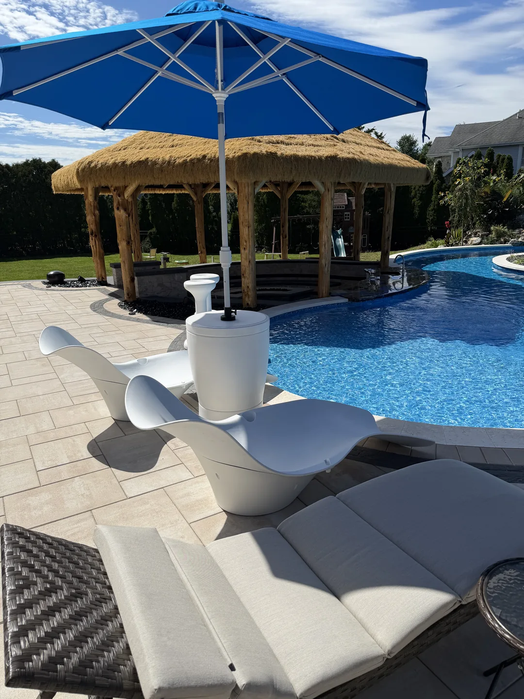 Loungers and umbrella on the finished pool deck, East Northport