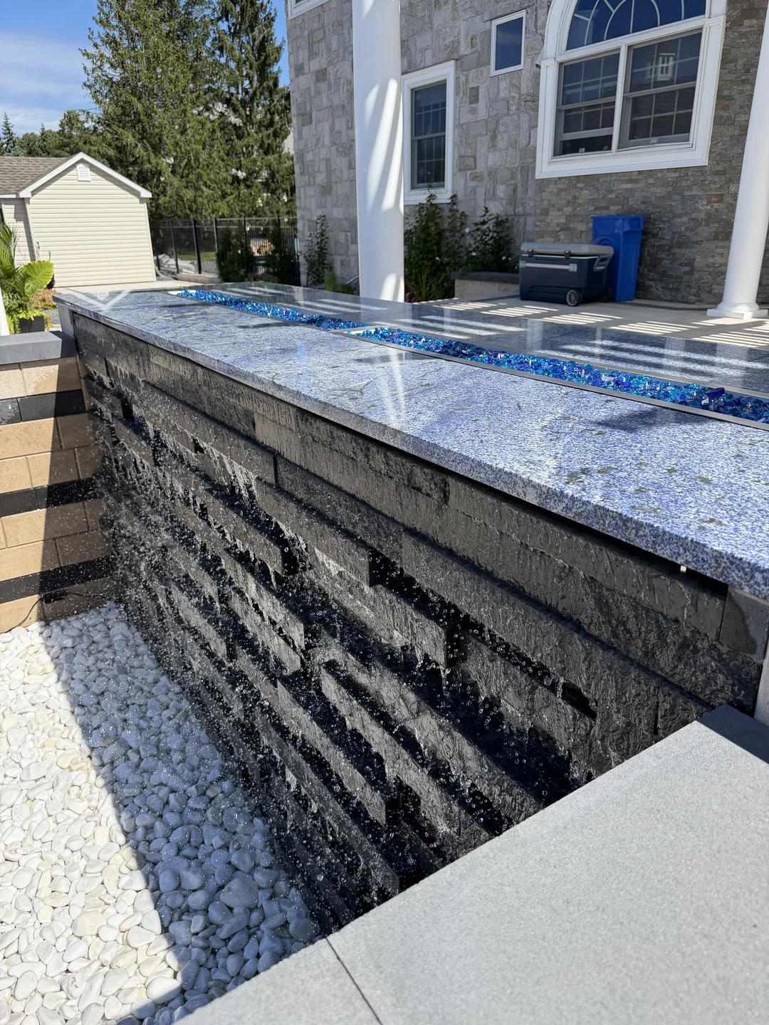 Detail of the glass-tile sheer-descent water wall, East Northport