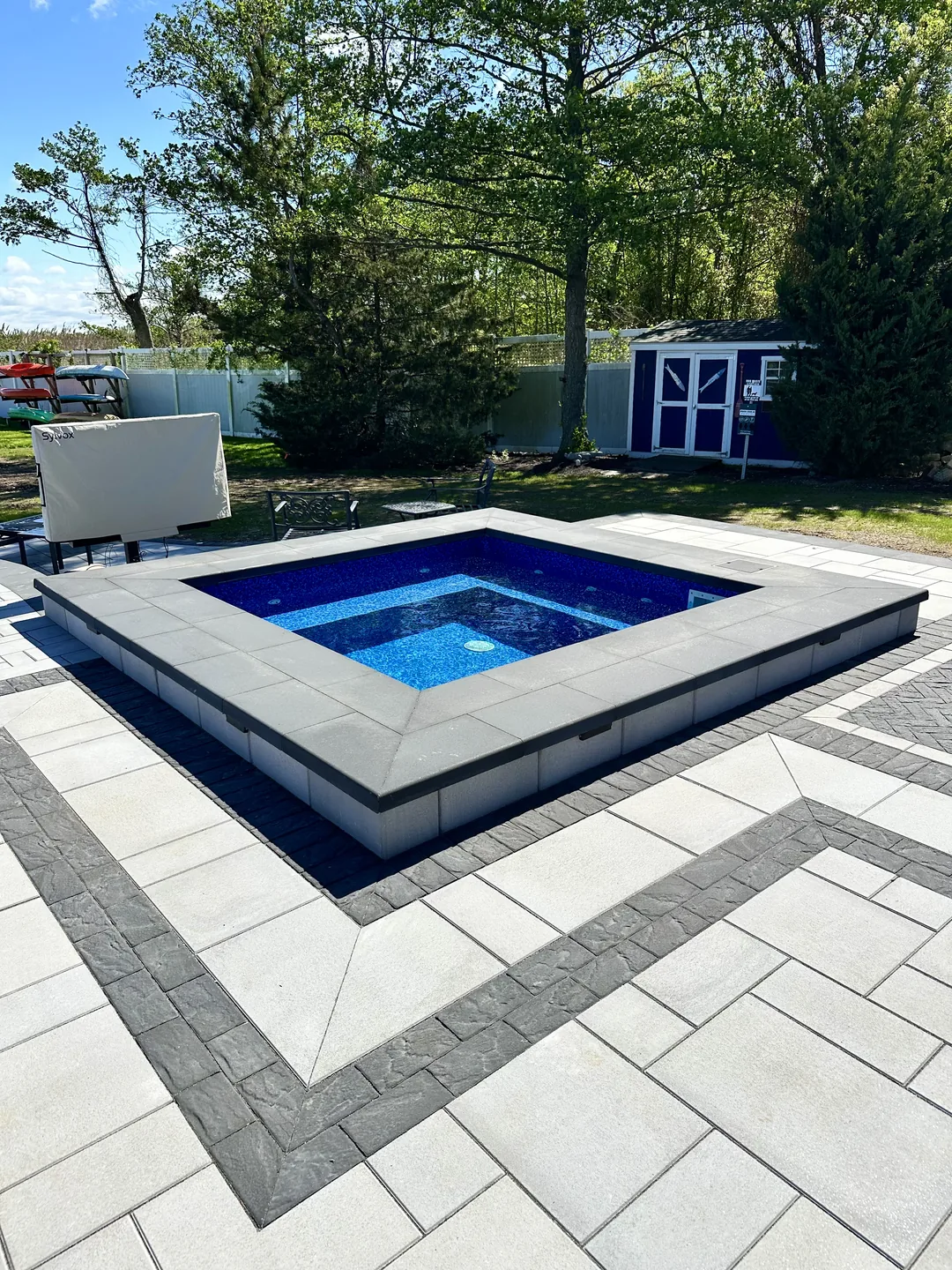 The finished raised spa squared into the large-format paver deck, Great River