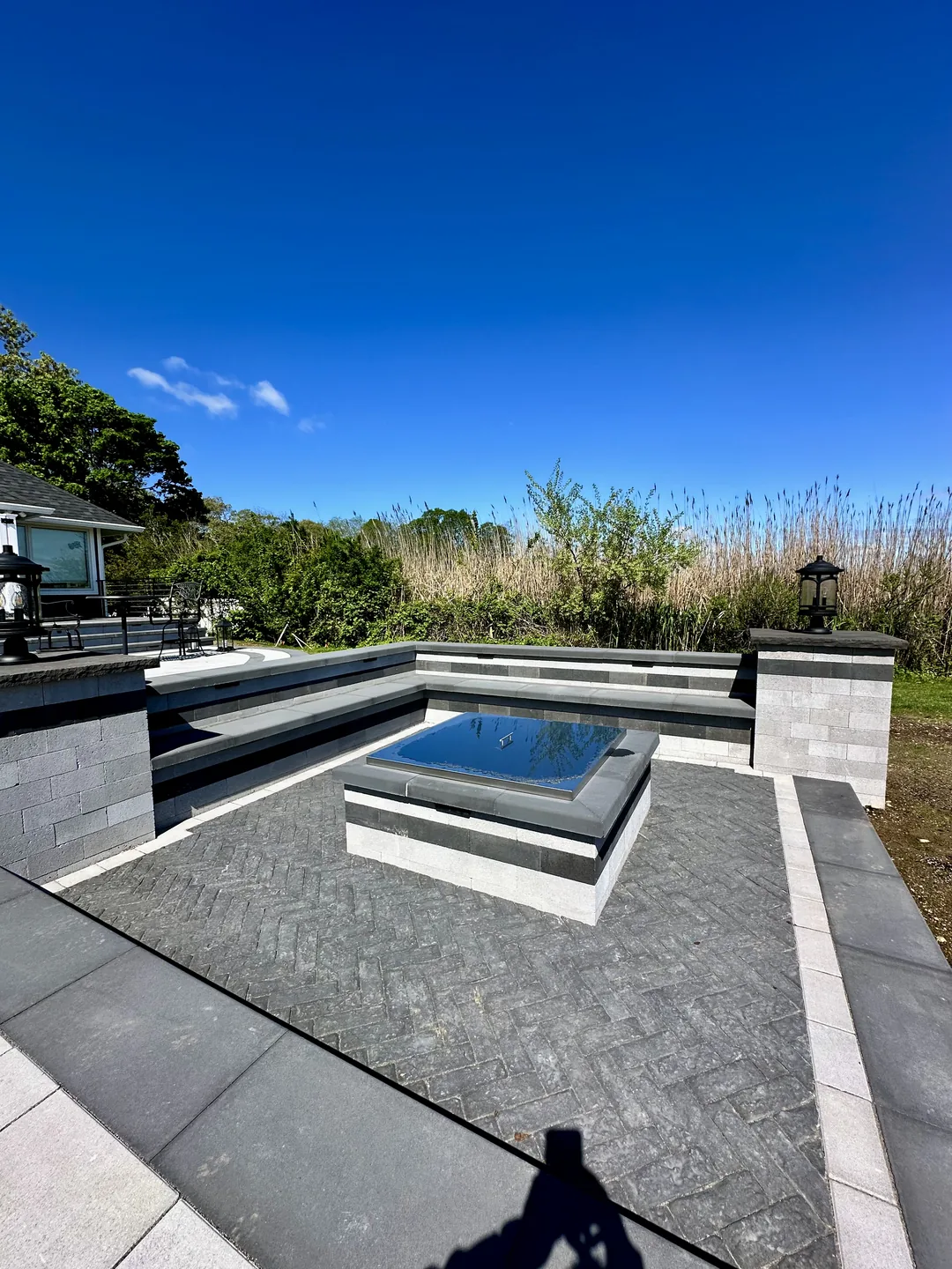 Raised spa and pool with the deck running out to the lawn, Great River
