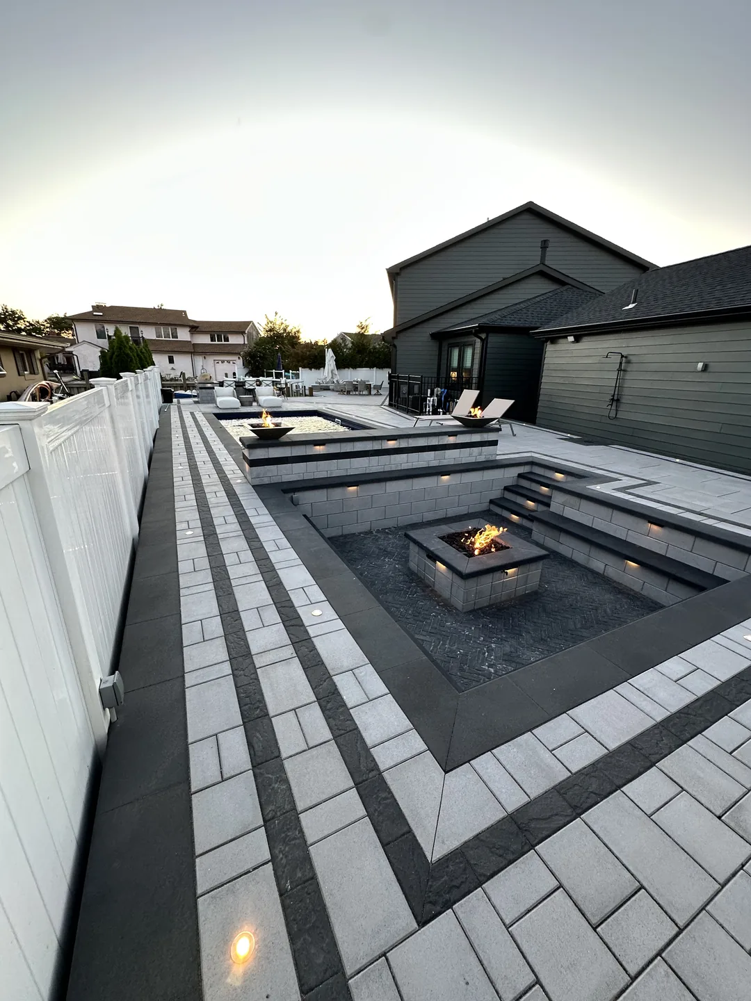 Wide view across the spa and deck at dusk, Massapequa