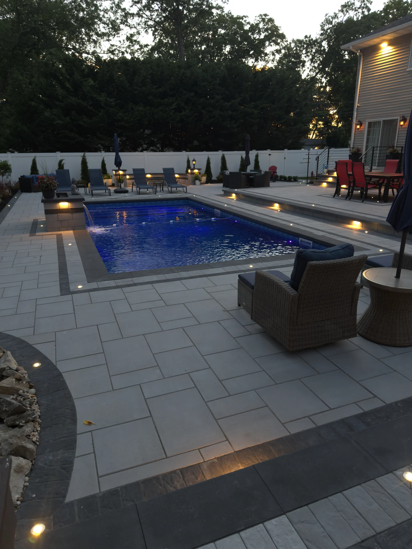 Pool and deck lighting seen from the house side, Nesconset