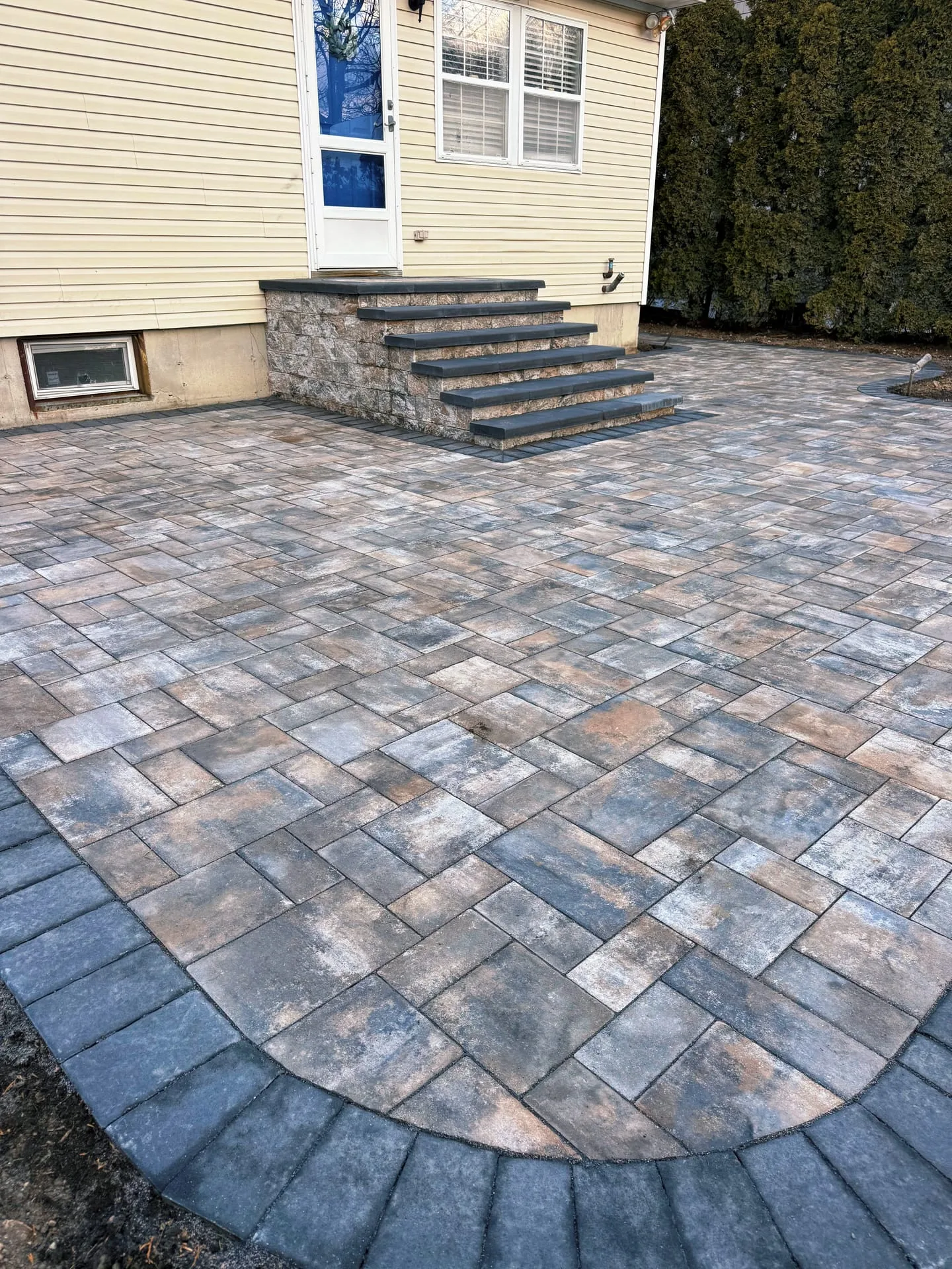 Patio with seating wall on Long Island