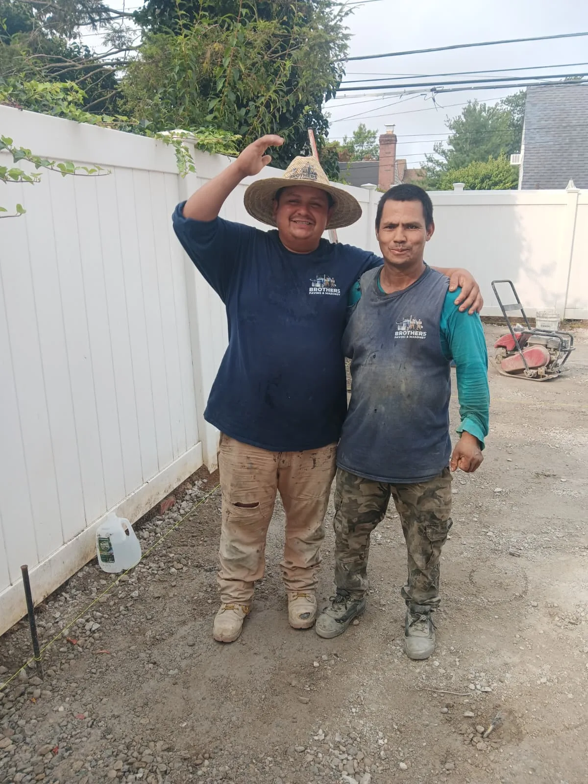 Two crew members at a jobsite